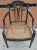 A very distinctive, structurally sound 18th Century Ebonized, Inlaid and Decorated Cane Seat Armchair measuring 20.5" in...