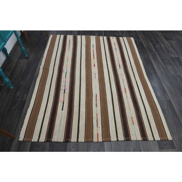 Vintage Hand-Knotted area rug is a semi-antique vintage area rug. The '70s Eastern region of Anatolia's unique rug is...