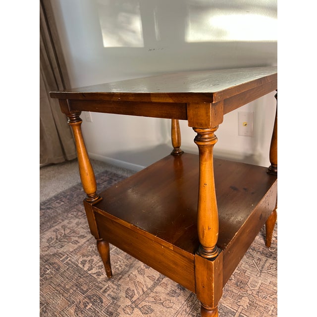 American-made solid pine two-tier side table with a single lower drawer, stamped Pine Shop Originals beneath. Structurally...