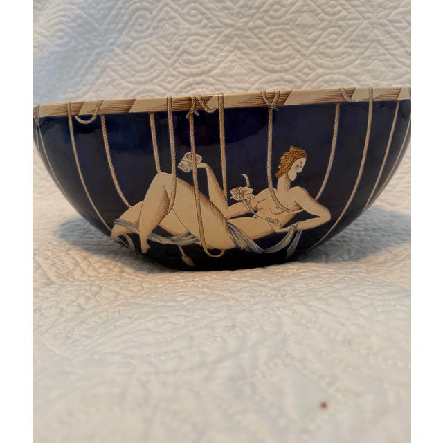 A spectacular and highly decorative Richard Ginori porcelain centerpiece bowl, executed in a dramatic deep cobalt blue and...