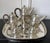 A large six-piece sterling silver service for coffee and tea that consists of a gallery tray, a coffee pot, a tea pot, a...