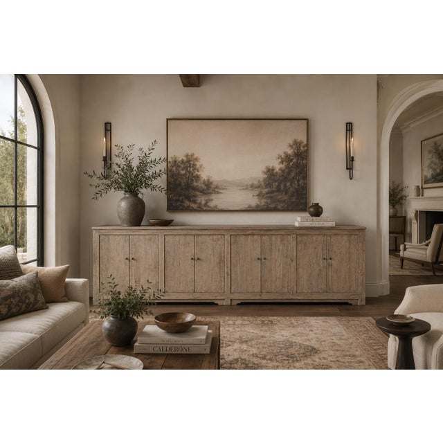 Handcrafted from solid wood, this extra-long sideboard features a multi-tonal weathered finish that brings dramatic...