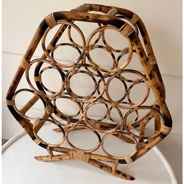 Large vintage bamboo wine rack with the classic tortoiseshell finish. Fits 12 bottles of wine. Original sticker reads...