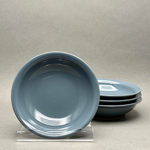 This is a beautiful set of four stoneware cereal or soup bowls from Denby’s Storm collection, featuring a sophisticated...