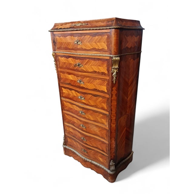 - kingwood and tulipwood veneer on moastly solid oak wood construction - features five drawers and a drop leaf desk that...