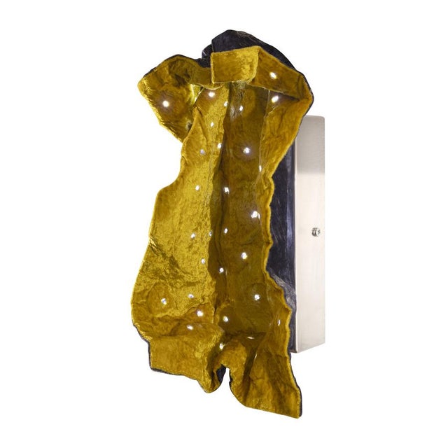 The inspiration: a short circuit between haute couture and light sculpture "wrinkled" is a tactile and interactive...