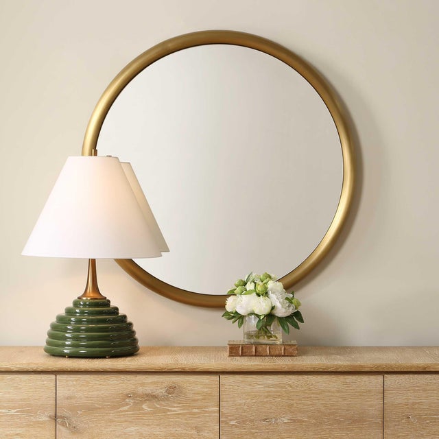 This Sleek Round Mirror Features A Contemporary Design With A Softly Rounded Stainless-steel Frame, All Finished In A...