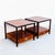 A pair of newly refinished teak and mahogany two-tier end tables by Michael Taylor for Baker’s “New World” collection,...