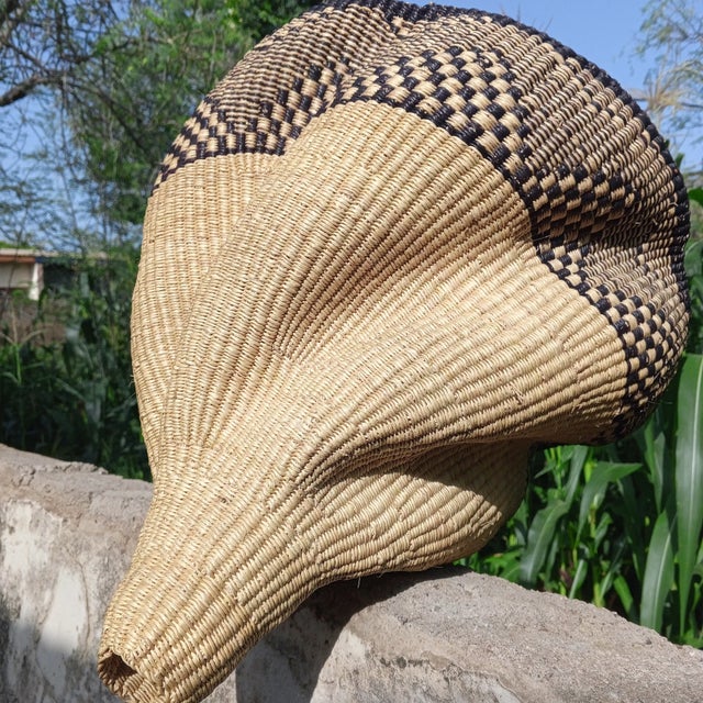 Elevate your home décor with the authentic Bolga Lampshade, handwoven in Bolgatanga, Ghana. Crafted from durable elephant...