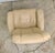 A Scandinavian style recliner and ottoman Attributed to Ekornes, their Stressless brand. With teak wood bases and metal...