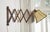 Vintage mid-century scissor wall lamp sconce with an adjustable wooden accordion arm and faceted bell lampshade with green...