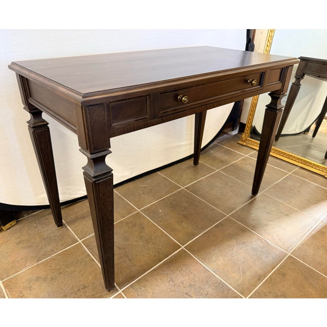 Handsome Ethan Allen custom writing desk featuring a rich Nightfall finish, architectural Avery legs and antique brass...