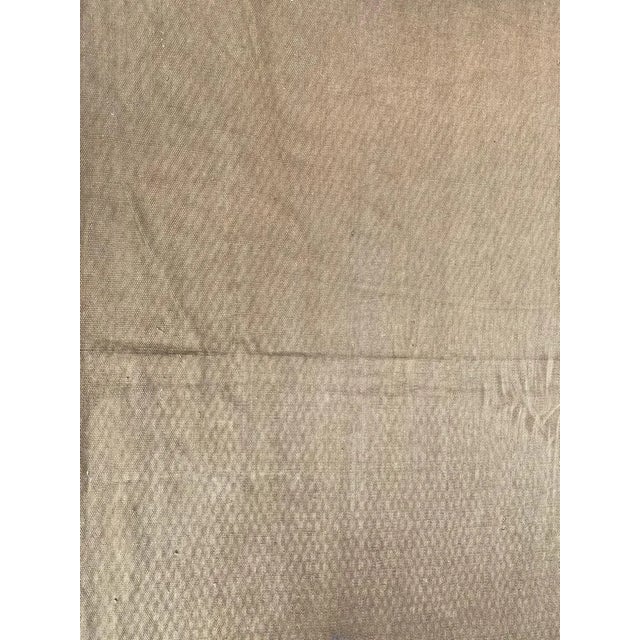 Nice flat rug with a khaki field color, entirely hand woven with cotton on cotton foundation.