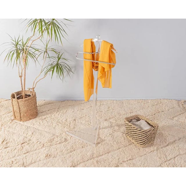 Rare clothing racks from the 1980s. High quality frame made of transparent acrylic with a stainless steel clothing hook....