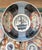 A handsome antique Japanese Imari porcelain center bowl decorated in the traditional palette of underglaze cobalt blue,...