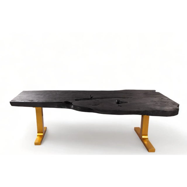 Crafted from a single, majestic slab of wood spanning an impressive 98 inches in length, this exquisite table embodies...