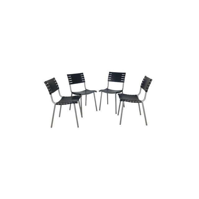 Set of Harvink dining chairs designed by Ruud Jan Kokke from the 90s, with a sleek design with black plywood seats and...