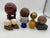 Collection of 8 Spheres featuring 4 in marble and stone, 2 resin, 1 Ceramic and one in brass. Seven come with bases. The...