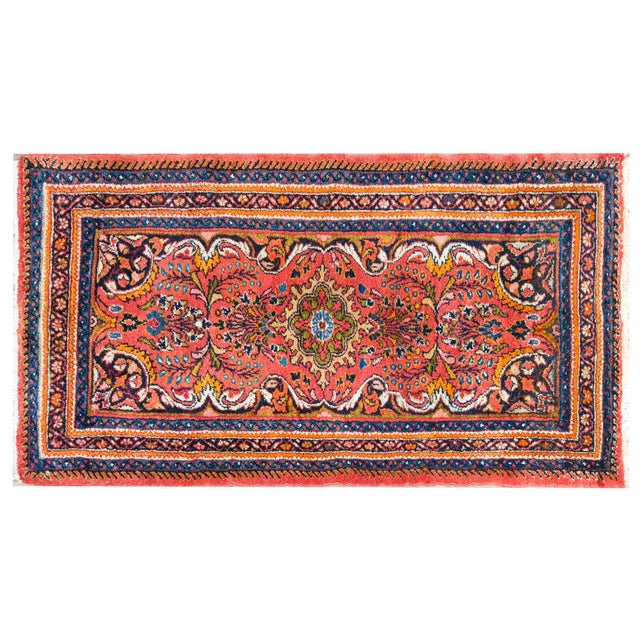 This early 20th-century Persian Mehraban rug is a radiant expression of village weaving tradition from northwestern Iran....