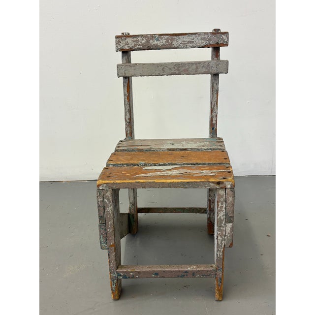 Small Primitive painted chair. Shows many layers of paint throughout its life! perfect to use as a bookstand, plant stand,...