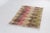 This is a vintage Turkish Oushak rug from the Mid 20th Century. The piece was hand-knotted.