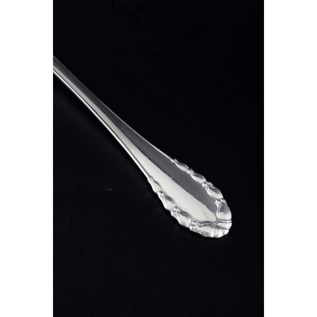 Georg Jensen, Denmark, c. 1915–1919 Large serving spoon in the "Lily of the Valley" pattern. Polished sterling silver with...