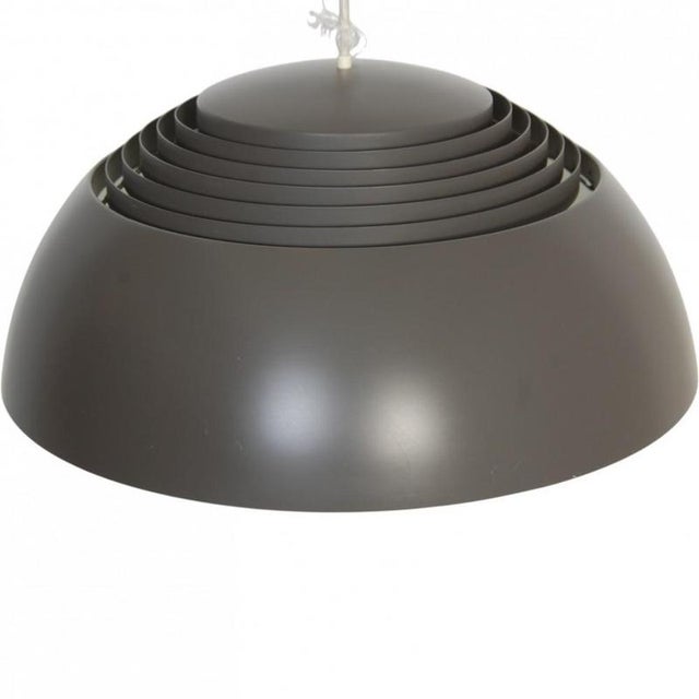 Arne Jacobsen Royal pendant lamp with a grey lacquered steel shade. The lamp is from around the 1980s and appears in good...