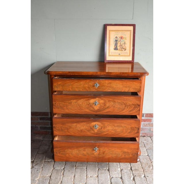 19th-century Dutch mahogany chest of drawers. The height is 91 cm. The width is 90 cm. The depth is 49 cm. with four...