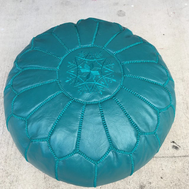 Brightly colored Moroccan hand made teal on teal leather top stitched pouf or ottoman. Zippered bottom and a beautiful...