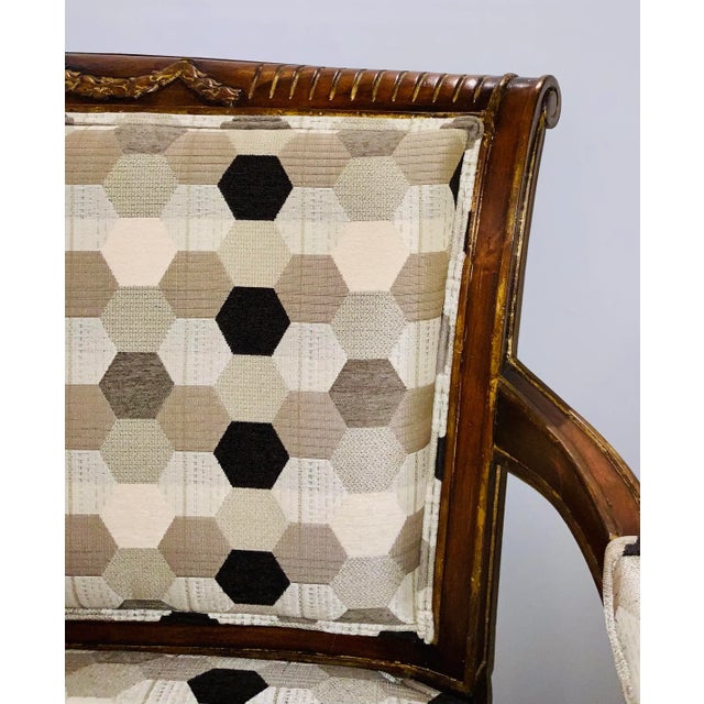 This gorgeous settee is a real juxtaposition of style. It has a warm traditional mahogany frame with painted gold accents,...