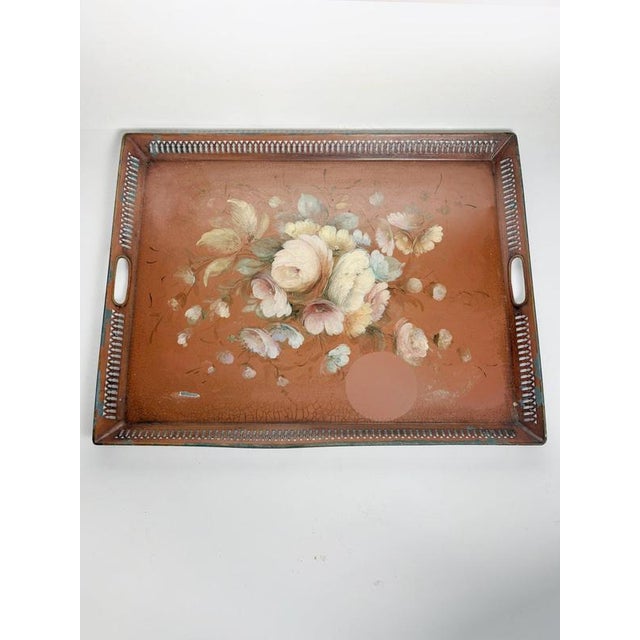 French rectangular serving tray dating from the 1950s, crafted from metal and decorated with a hand-painted floral...