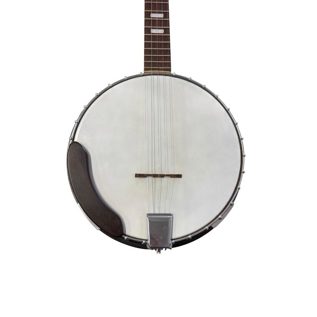 A handsome vintage Lyle five-string resonator banjo featuring classic American-inspired styling with an eagle inlay on the...