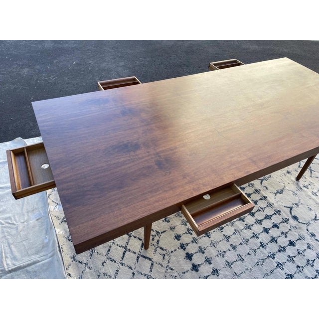 A rare and commanding mid-century modern executive table designed by George Nelson for Herman Miller. This expansive...