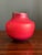 This is a stunning iridescent red artisan hand-thrown pottery vase by renowned pottery and artist Tom Krueger. Krueger...