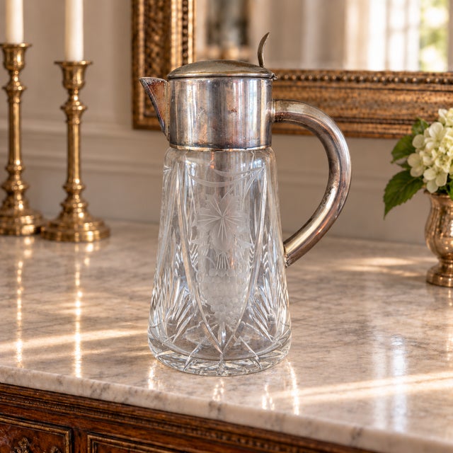 Its tall, tapered crystal body displays an elegant combination of wheel-engraved grape clusters, foliage, scrolling vines,...