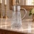 Its tall, tapered crystal body displays an elegant combination of wheel-engraved grape clusters, foliage, scrolling vines,...