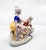 An elegant Gräfenthal porcelain figurative group executed in a refined Italian Rococo-style courtship scene, inspired by...