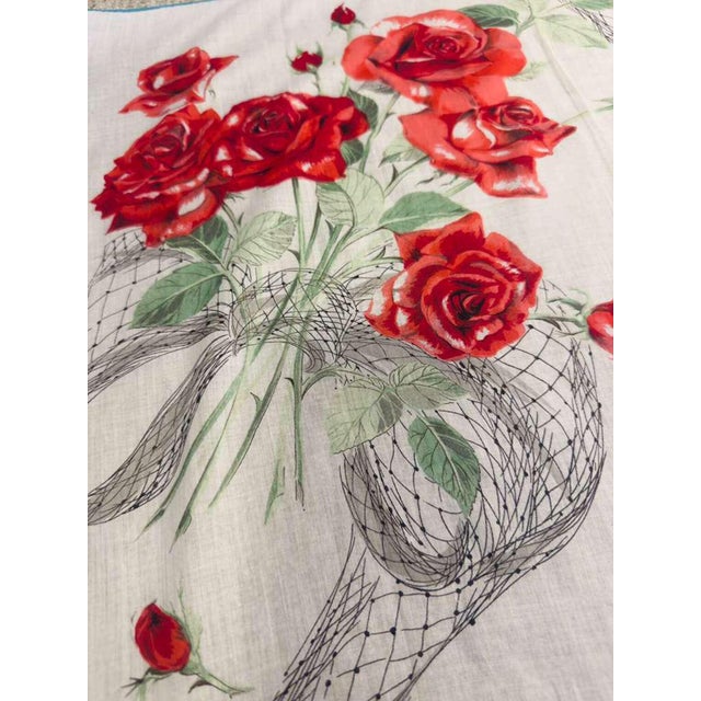 "A beautifully expressive vintage French scarf dating to the 1940s, featuring painterly red roses entwined with an...