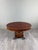 An elegant oval empire-style table dating from the 19th century. it features a beautiful oval top with a beaded border,...