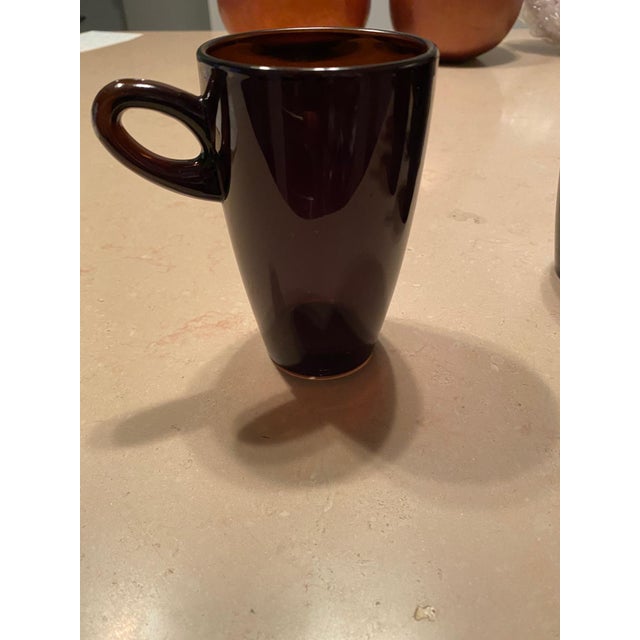 A set of 6 brand-new amber/sepia glass coffee and tea mugs, purchased at Barney’s New York, perfect for contemporary or...