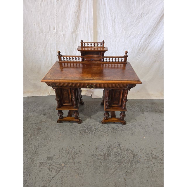 Handsome late-19th-century Renaissance Revival writing desk/console crafted in burled walnut with rich figuring and a warm...