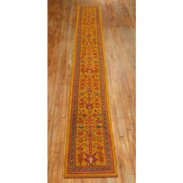 An authentic narrow one of a kind antique Turkish Oushak runner. The size is original and was originally woven in the 19th...