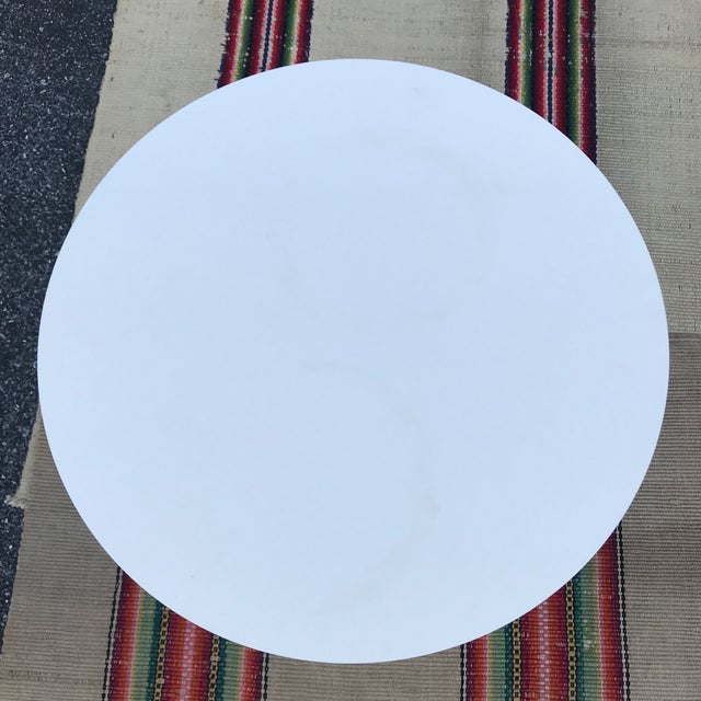 A Eero Saarinen for Knoll White tulip side table 1970’s. 20” across, 20 3/4” tall. Very good condition, some minor paint...