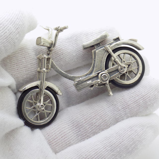 A large vintage miniature depicting a scooter moped, handcrafted in Continental Silver (800/000) in Italy between the...