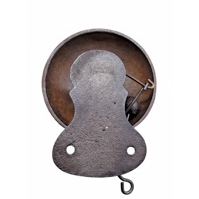 A petite Victorian cast-iron pull bell, dating to the late 19th century and retaining a wonderful, resonant tone. Marked...