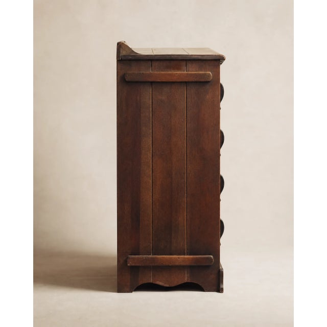 A charming chest of drawers with classic Colonial Revival styling and a warm, richly toned wood finish. Featuring four...