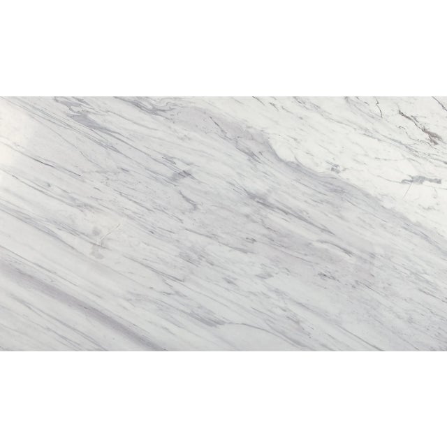 Anchor your space with this chic, contemporary polished marble coffee table finsihed in antique gold. Perfect for...