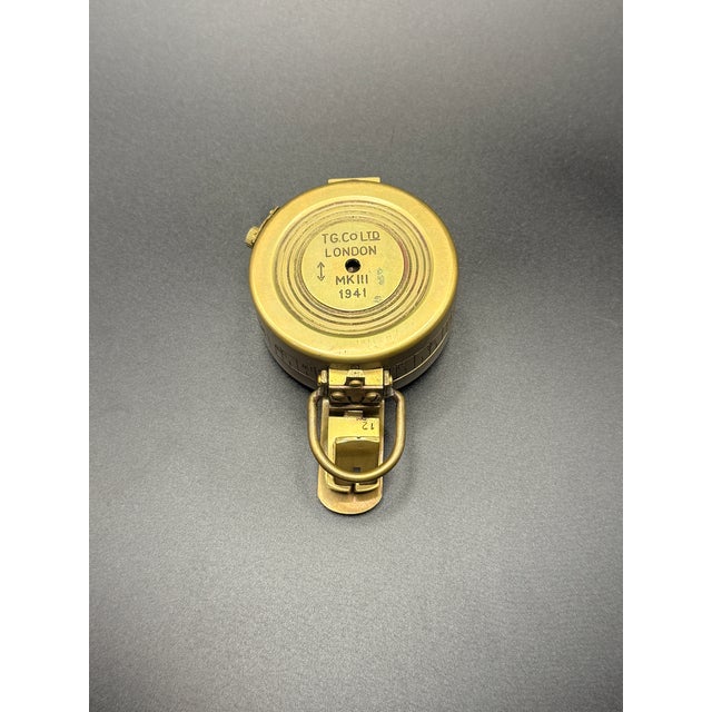 A solid vintage brass marching compass modeled after early military survey instruments. Features a flip-open sighting lid,...