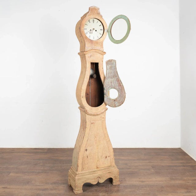 Swedish mora grandfather clocks are noted by their gentle curves and classic style as seen in this tall and slender long...