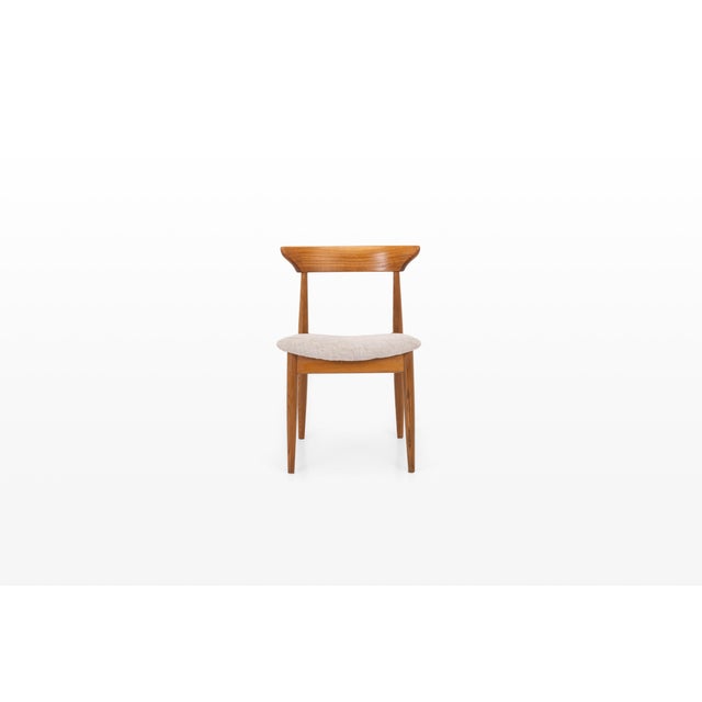 A beautifully crafted danish modern dining chair, produced in denmark during the 1960s. Made from solid teak, the chair...